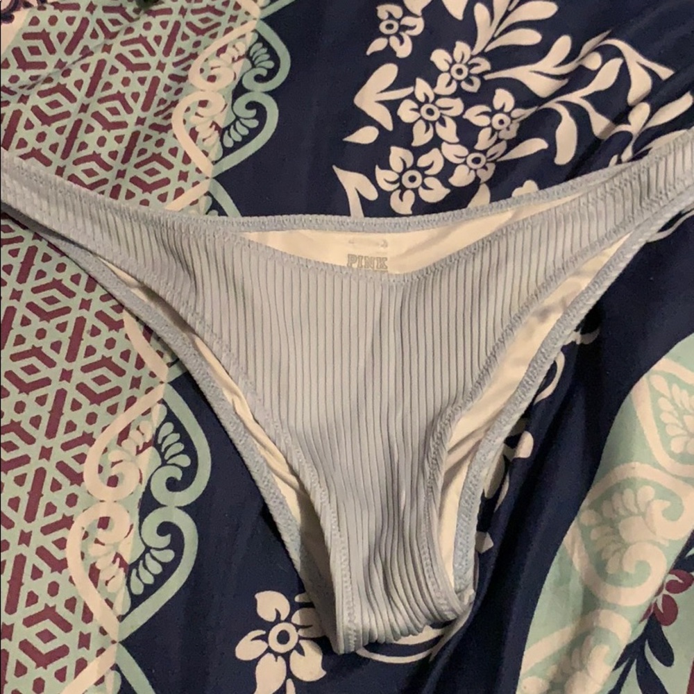 blue bathing suit bottoms, a little cheacky.